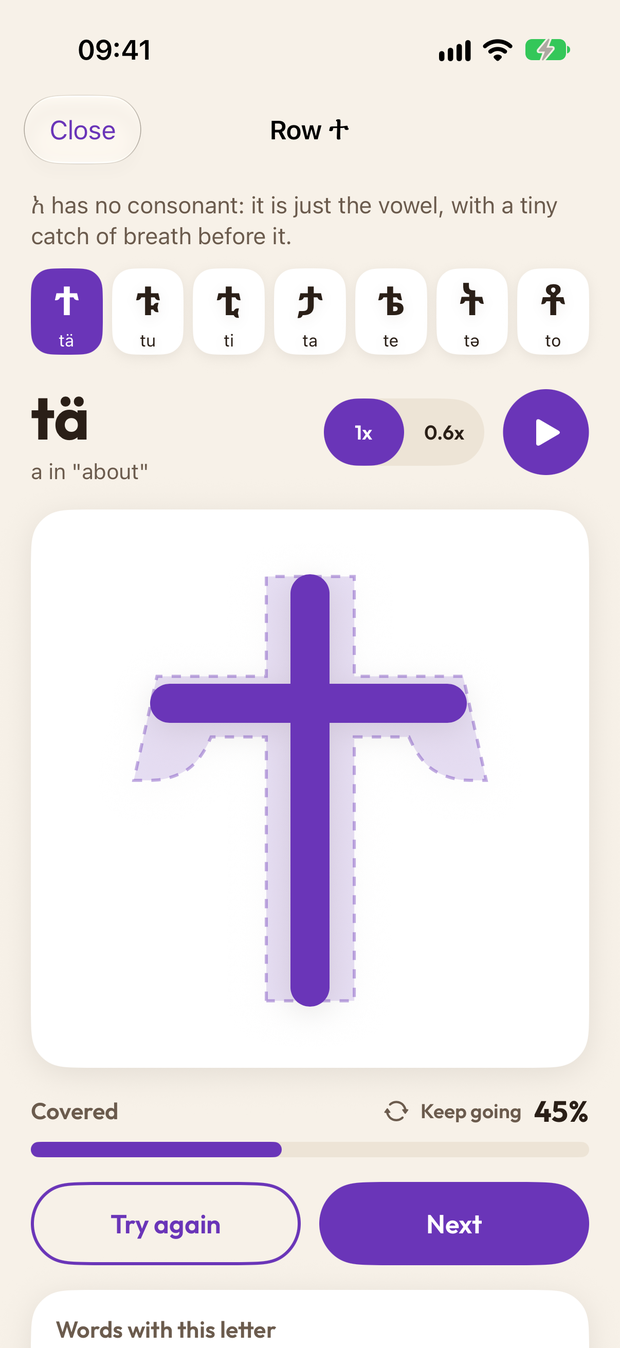 Tracing the letter ሊ with a finger